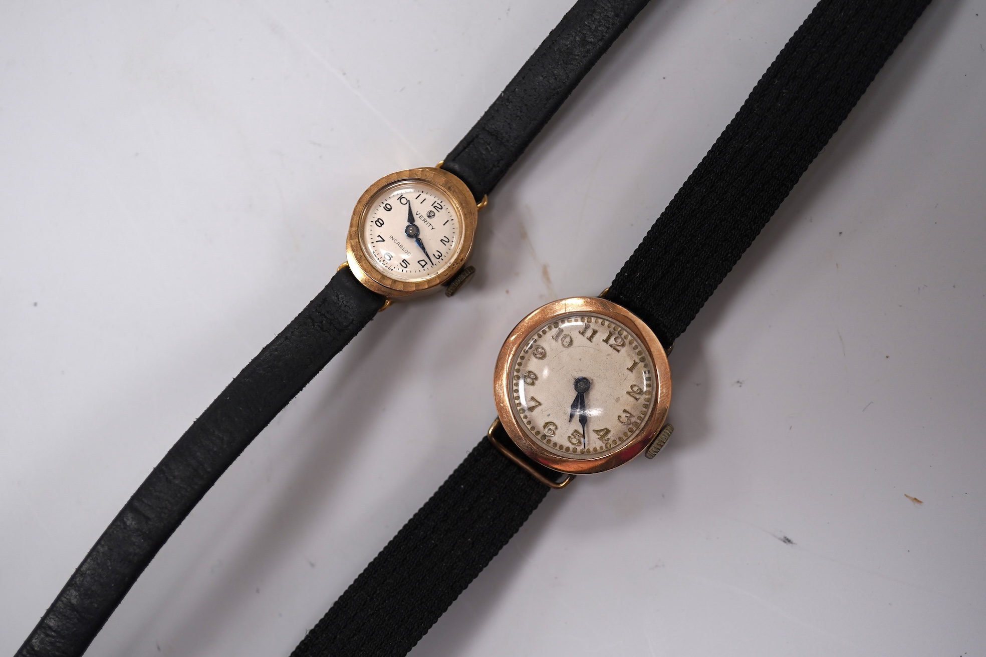 A lady's 9ct gold Verity manual wind wrist watch, with Arabic dial, case diameter 22mm, on a leather strap, together with one other lady's 9ct gold manual wind wrist watch, on a fabric strap.